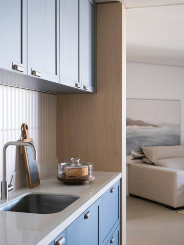 modern-kitchen-with-blue-cabinets-and-a-sink-.jpg Modern kitchen with blue cabinets and a sink.