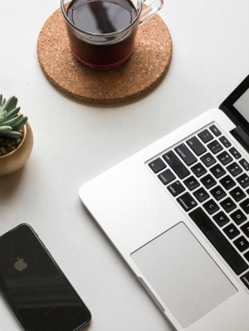 space-gray-i-phone-x-beside-turned-on-laptop-beside-coffee-and-succulent-plant.jpg space gray iPhone X beside turned on laptop beside coffee and succulent plant